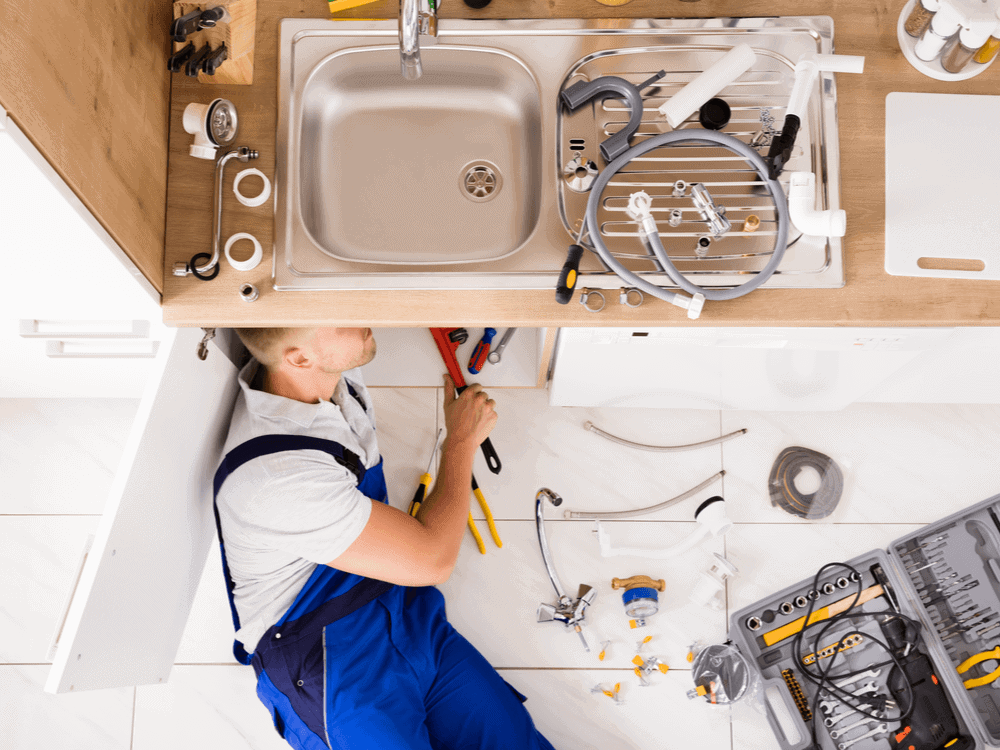 Clean Flow plumbing work: pipework, fittings and tools on site.
